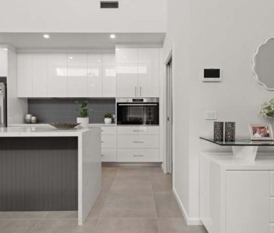 “Elegant white kitchen with a grey-accent island and sleek contemporary finishes.”
