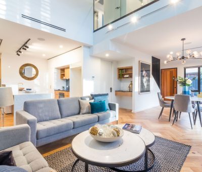 “Spacious open-plan living and dining area with contemporary furnishings and abundant natural light.”