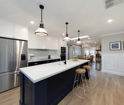 “Stylish Campbell kitchen renovation with a navy feature island and modern pendant lighting.”