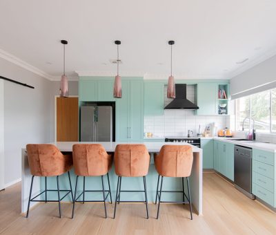 “Freshly renovated Queanbeyan kitchen featuring mint green cabinetry, modern pendant lighting, and a bright open layout.”